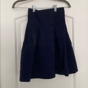 Midi blue skirt with flourish opening